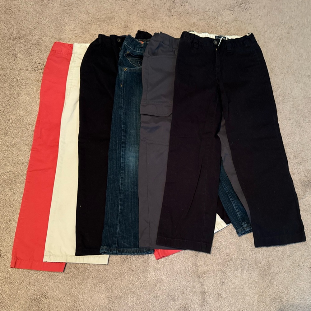 5 pairs of size 7 pants: khaki, 2 black, jeans, grey and 1 dark pink (size 8)